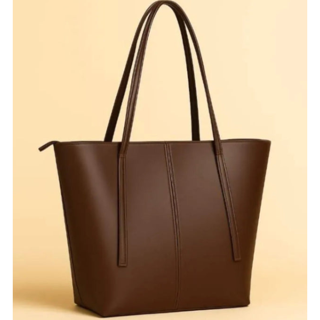 Brown leather tote bag on a beige background