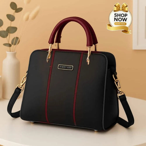 Black handbag with red accents on a beige surface, with a 'Shop Now' button in the corner.